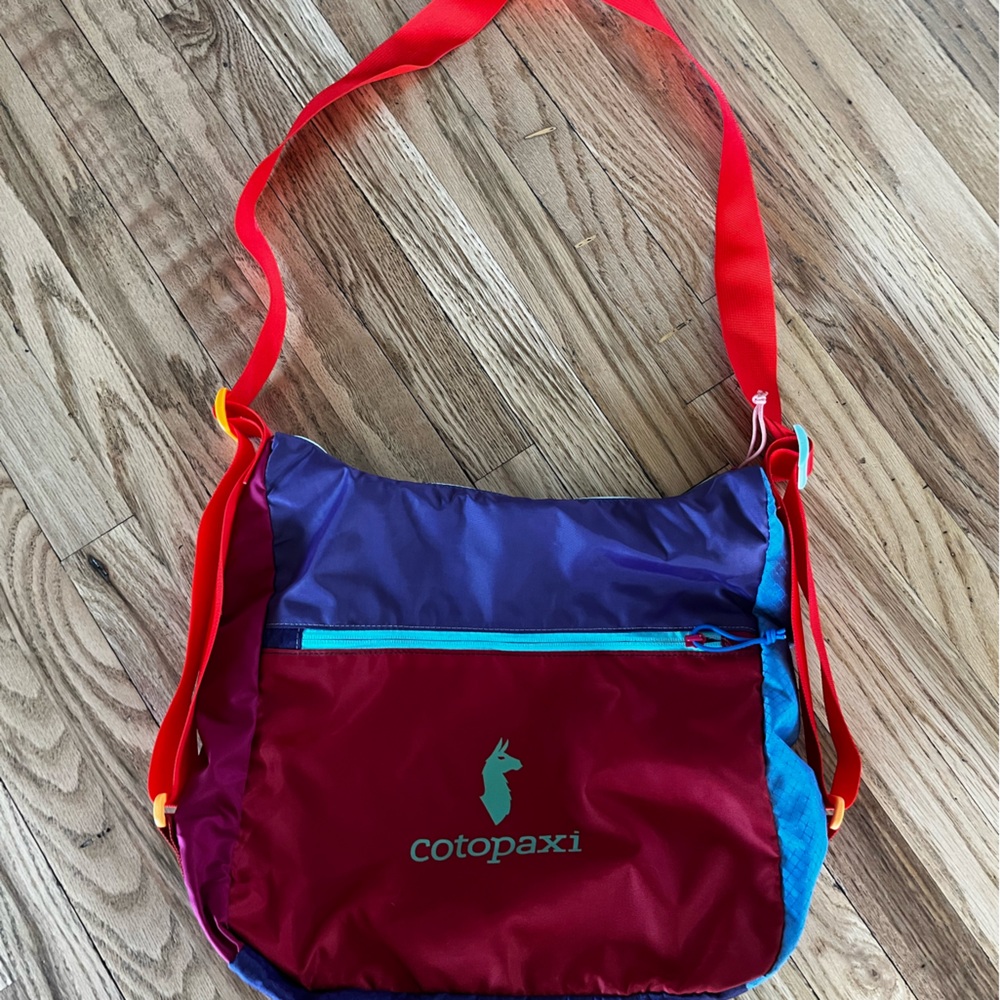 Cotopaxi tote cross body bag.